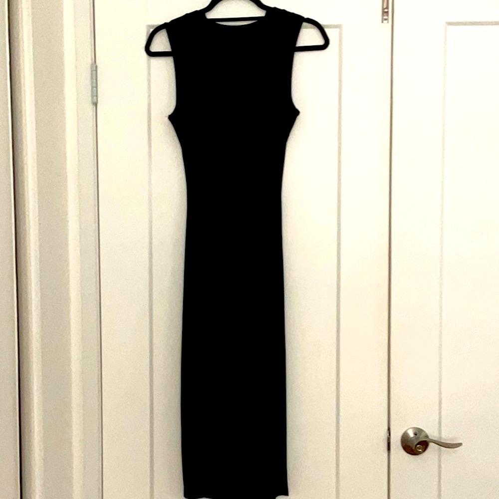 Black midi cutout dress. Super stretchy, size small. New without tags.